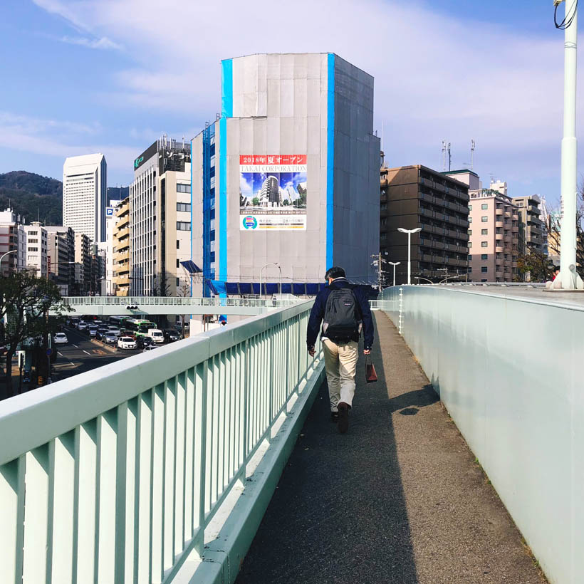 One of the many walking bridges over the busy streets in the center of Kobe.