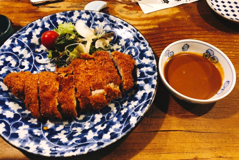 Tonkatsu - deep fried chicken covered with panko breadcrumbs - in a small izakaya in the center of Kyoto, Japan.