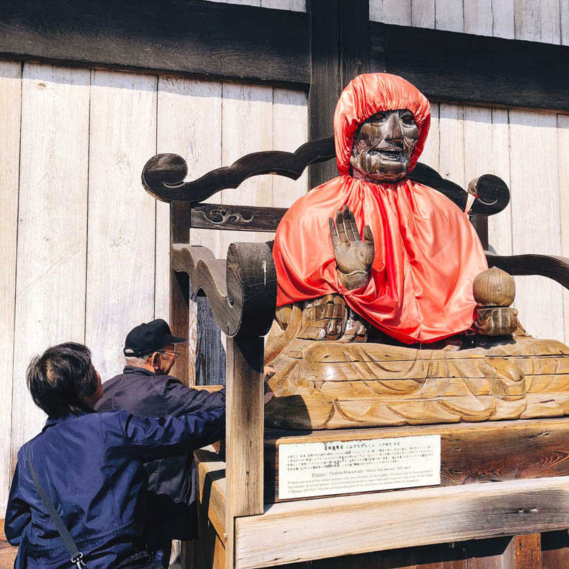 A dressed up statue of Binzuru (Pindola Bharadvaja), one of the disciples of Buddha, just outside of the hall. 