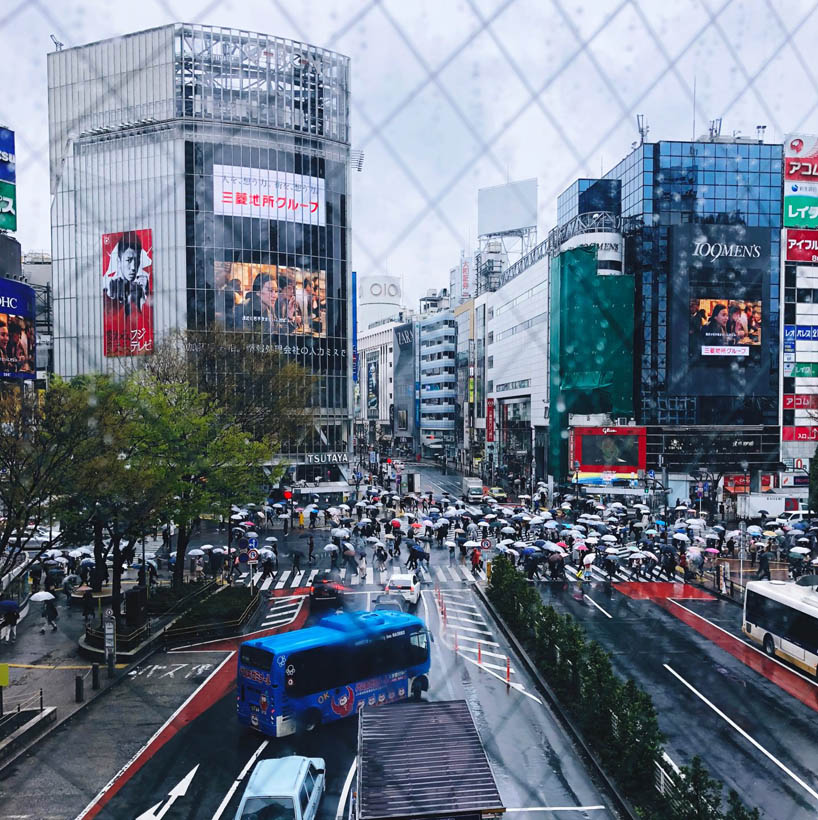 The famous Shibuya Scramble Crossing as seen from Shibuya Station on a rainy day in Tokyo, Japan.