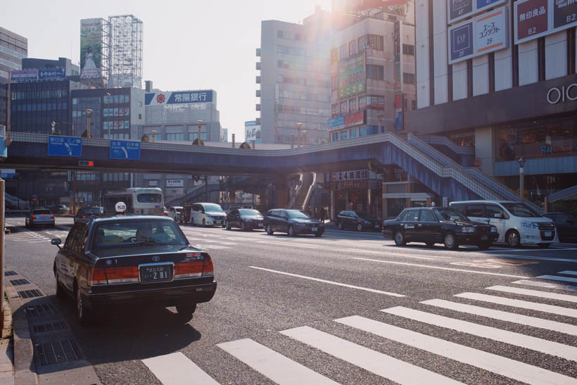 A taxi waiting in front of the entrance of Ueno Station in Tokyo, Japan.