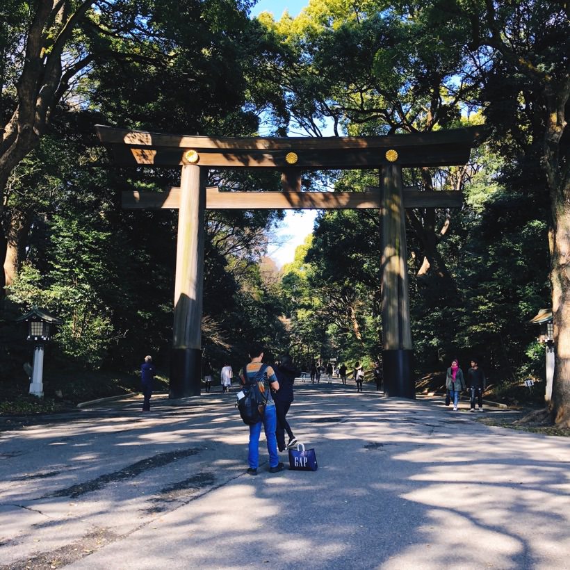 A large wooden torii gate at the entrance of Yoyogi Park in Tokyo, Japan.