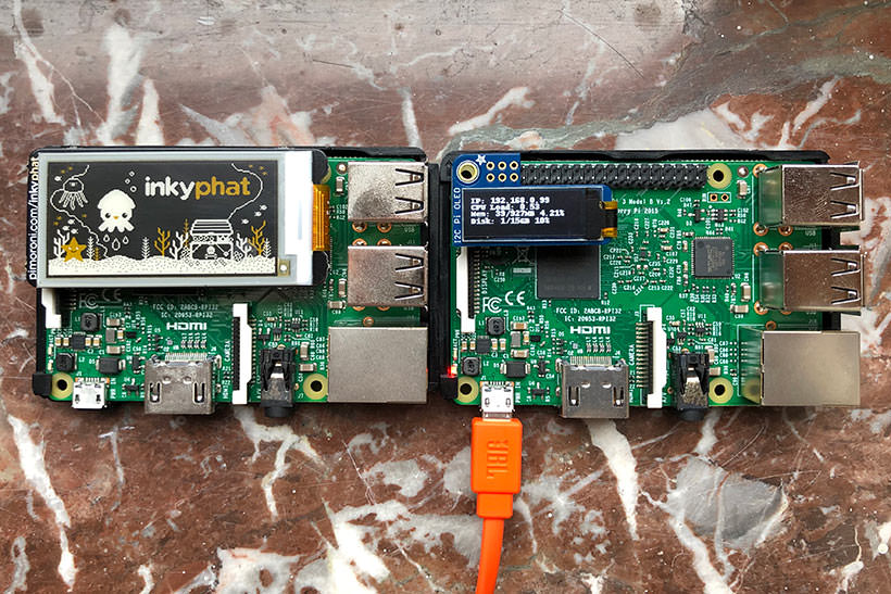 A set of Raspberry Pi computers with an eInk and OLED screen