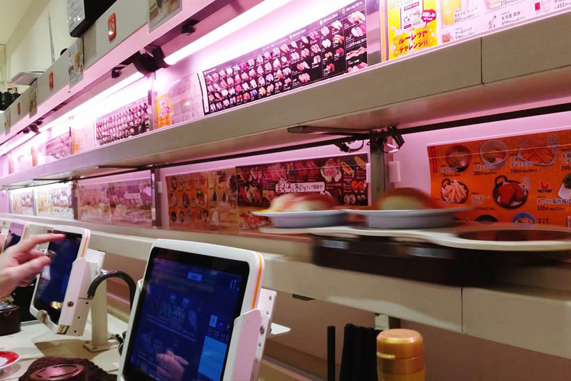 Moving plates on a conveyor belt at Genki Sushi in Shibuya. These plates stop right in front of the customer and will wait until they are picked up.