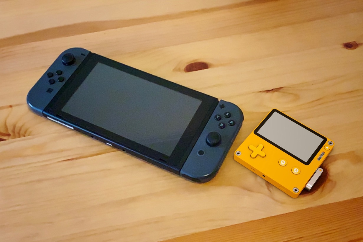 A 3D model of a Playdate in Augmented Reality, next to a Nintendo Switch for scale.